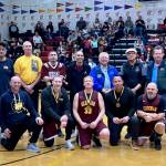 Attending members of the Gold Medal Hall of Fame pose for a photo on Friday, March 24, at the Juneau Lions Club 74th Gold Medal Basketball Tournament at the Juneau-Douglas High School: Yadaa.at Kalé gymnasium. (Klas Stolpe/For the Juneau Empire)