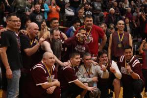 Hoonahs Masters Bracket team poses for a group photo on Saturday after being crowned this years champs for the M bracket in the Gold Medal Basketball Tournament at JDHS. (Ben Hohenstatt / Juneau Empire)
