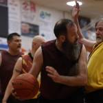 Hoonahs Mark Prpich (22) drives the lane against Juneaus Doug Draowski (5) on Saturday during the Gold Medal championship game for M bracket at JDHS. Prpich finished the game with 10 points. (Ben Hohenstatt / Juneau Empire)