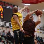 Hoonahs Michael Mills (1) fights for the rebound against Juneau on Saturday during the championship M bracket game for the 2023 Gold Medal Basketball Tournament. Mills finished the game with 8 points