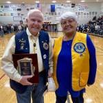 Ted Burke and wife Jan pose for a photo at the Gold Medal Basketball Tournament on Saturday. Burke was the recipient of the Dr. Walter Soboleff Award. (Klas Stolpe/For the Juneau Empire)
