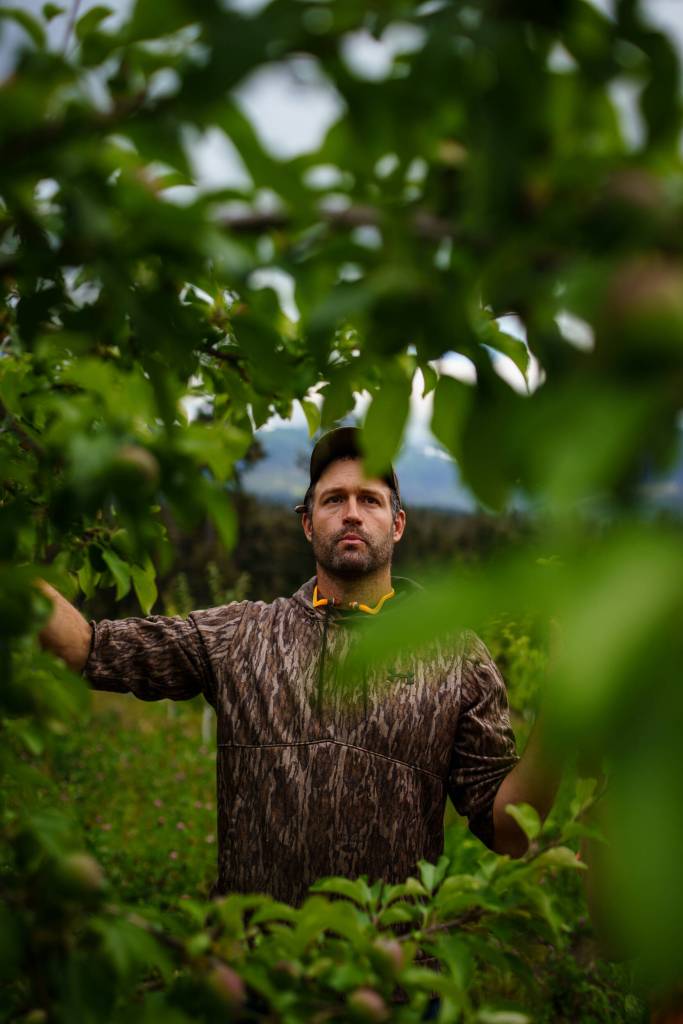 Robert Bishop of Alaska Apple Farms in Hoonah, shows off one of his regionally developed apple trees. Bishop, who has presented at each Farmers Summit, is generous in sharing his expertise on fruit cultivation unique to Southeast Alaska. (Courtesy Photo / Bethany Goodrich)