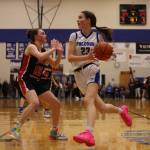 TMHS Cailynn Baxter (23) drives while guarded by JDHS Gwen Nizich (15) during a Region V Tournament game at TMHS. Baxter earned second team all-state honors for her play this season.