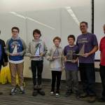 (Left to right): Britt Smith, President of the National Engineering Society, Floyd Dryden Middle School team members: Tyler Oudekerk, Caden Morris, Dan Degener, FDMS Coach Alan Degener and State Mathcounts Coordinator Clark Milne. FDMS team receiving their second place trophies at the state Mathcounts tournament in Fairbanks on March 25.