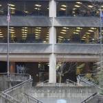 Flags fly outside the State Office Building on Friday, where a note police described as a possible threat against children was discovered at midday on Friday. (Mark Sabbatini / Juneau Empire)