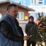 Alfie Price performs a traditional blessing of the ground on Friday at Marine Park where the Kootéeyaa Deiyí (Totem Pole Trail) will be installed by the end of April. (Jonson Kuhn / Juneau Empire)