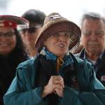 Áakʼw Ḵwáan spokesperson Fran Houston addresses a crowd of people during a blessing ceremony on Friday at Marine Park as part of the Kootéeyaa Deiyí (Totem Pole Trail) that will run along the downtown Juneau waterfront. (Jonson Kuhn / Juneau Empire)
