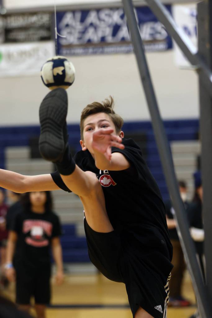 Cullen Sias, 13, competes in his favorite Traditional Games event, one-foot high kick. Sias was among the Traditional Games athletes in town from Yukon, Canada. (Ben Hohenstatt / Juneau Empire)
