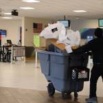 A custodial official wheels trash past the Alaska Airlines counter at Juneau International Airport at midday Wednesday. Leaders with the state House majority discussed having Alaska State Troopers search the airport after members of the minority caucus fled the Alaska State Capitol during the morning over a fight about education funding, in an attempt to prevent further action on the matter. Airport officials said they were not aware of lawmakers attempting to catch flights during the standoff. (Clarise Larson/ Juneau Empire)