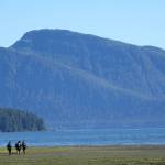Trevor Fredrickson, Sam Fredrickson and Beebuks Kookesh hike down to the shore on the way to be picked up by a floatplane that would return them home, to Angoon. (Courtesy Photo / Mary Catharine Martin)