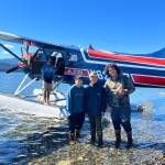 From left to right, Sam Fredrickson, Trevor Fredrickson and Beebuks Kookesh as they board the Ward Air floatplane that would return them home, to Angoon, after paddling and hiking the cross-Admiralty canoe route. (Courtesy Photo / Mary Catharine Martin)