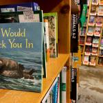 The childrens book I Would Tuck You In, illustrated by Mitchell Thomas Watley, is shown at a bookstore in Portland, Ore. in this April 5, 2023 photo. Publisher Sasquatch books, owned by Penguin Random House, said Wednesday, April 5, 2023, it has ended its publishing relationship with Watley after he was arrested on allegations of leaving violent, transphobic notes in stores around Juneau, Alaska. Watley told police he was motivated by fear following a deadly school shooting in Nashville that sparked online backlash about the shooters gender identity, court records show. (AP Photo/Claire Rush)