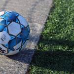 A soccer ball rests on the field at Thunder Mountain High School. The JDHS girls bested TMHS 9-0 on Wednesday behind five goals from Peyton Wheeler. The young JDHS team will play again soon, with Friday and Saturday games against Ketchikan High School. (Ben Hohenstatt / Juneau Empire)
