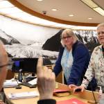 City and Borough of Juneau Mayor Beth Weldon and Assembly Member Michelle Bonnet Hale talk with City Manager Rorie Watt Wednesday night after the the 2024-2025 municipal budget was introduced at the city finance committee meeting. (Clarise Larson / Juneau Empire)