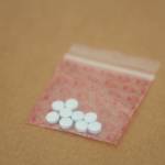 This March 10 photo shows fentanyl pills seized by police. A Juneau woman was arrested Saturday on a felony drug charge and police seized over 6,000 pills suspected to contain fentanyl. (Clarise Larson / Juneau Empire File)