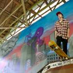 Courtesy Photo / Sunny Pittman 
Artwork by Skate Board member Jordan Kendall can be seen behind a skater at the Pipeline.