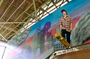 Courtesy Photo / Sunny Pittman 
Artwork by Skate Board member Jordan Kendall can be seen behind a skater at the Pipeline.