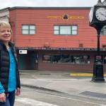 Leeann Thomas, third-generation owner of the Triangle Club, stands before the business her grandfather started in 1947. The location has a long history of Juneau businesses. (Laurie Craig / For the Downtown Business Association)