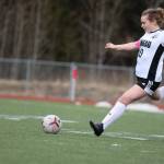 JDHS sophomore defender/midfielder Natalie Travis passes the ball to the center of the field during a Saturday afternoon game against Ketchikan at Thunder Mountain High School. (Clarise Larson / Juneau Empire)