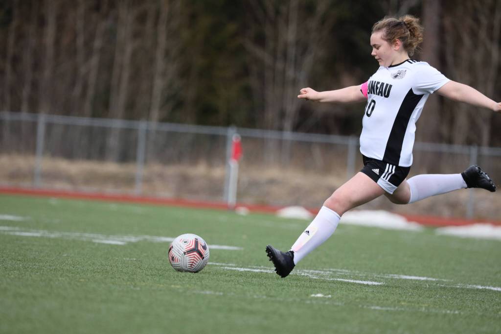 JDHS sophomore defender/midfielder Natalie Travis passes the ball to the center of the field during a Saturday afternoon game against Ketchikan at Thunder Mountain High School. (Clarise Larson / Juneau Empire)