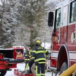 Capital City Fire/Rescue firefighters move to extinguish a trailer fire in early March. CCFR officials talk about the importance of staying fire safe as spring approaches. (Clarise Larson / Juneau Empire File)