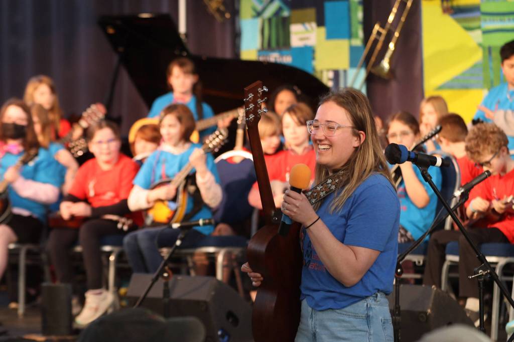 Alaska Music Matters Bluegrass Band students from Auke Bay and Sitʼ Eeti Shaanáx̱ Glacier Valley Elementary School open up Monday nights Folk Festival by playing bluegrass songs. (Jonson Kuhn / Juneau Empire)