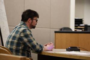 Mitchell Thomas Watley, 47, appears at the Juneau Courthouse late Tuesday afternoon. Watley is being charged with one count of felony terroristic threatening and faces up to five years in prison and a $50,000 fine for reportedly posting transphobic notes that referenced shooting children at three public locations in Juneau. (Clarise Larson / Juneau Empire)