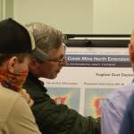 Members of the Juneau Forest Service along with Hecla staff answer questions posed by the public regarding the Greens Creek Mine expansion alternatives on Wednesday during an open house hosted by the Juneau Ranger District. (Jonson Kuhn / Juneau Empire)