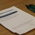 Forms available for members of the public to comment on proposed alternatives for the Greens Creek Mine expansion project were made available on Wednesday night during an open house at the Juneau Ranger District. The 45-day comment period will remain open until May 8. (Jonson Kuhn / Juneau Empire)