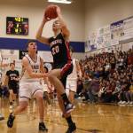 Ben Hohenstatt / Juneau Empire File 
JDHS senior Orion Dybdahl begins ascending for a dunk with Kayhis Jared Rhoads (15) and Marcus Stockhausen (34) in pursuit.