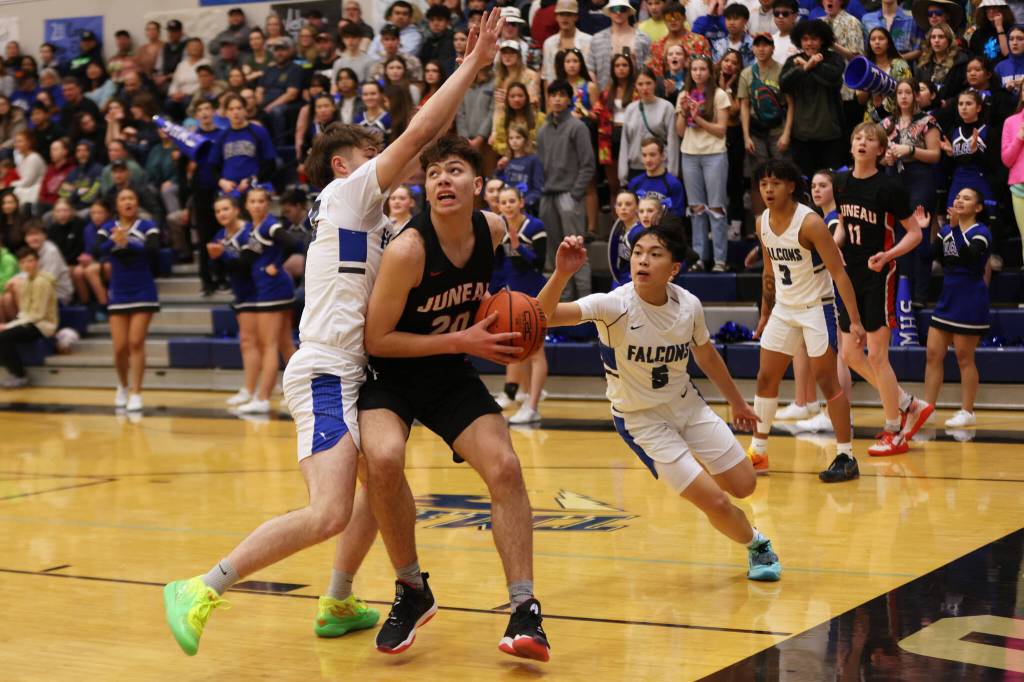 Ben Hohenstatt / Juneau Empire File 
JDHS senior Orion Dybdahl drives the lane for a layup against TMHS during this years Region V tournament.