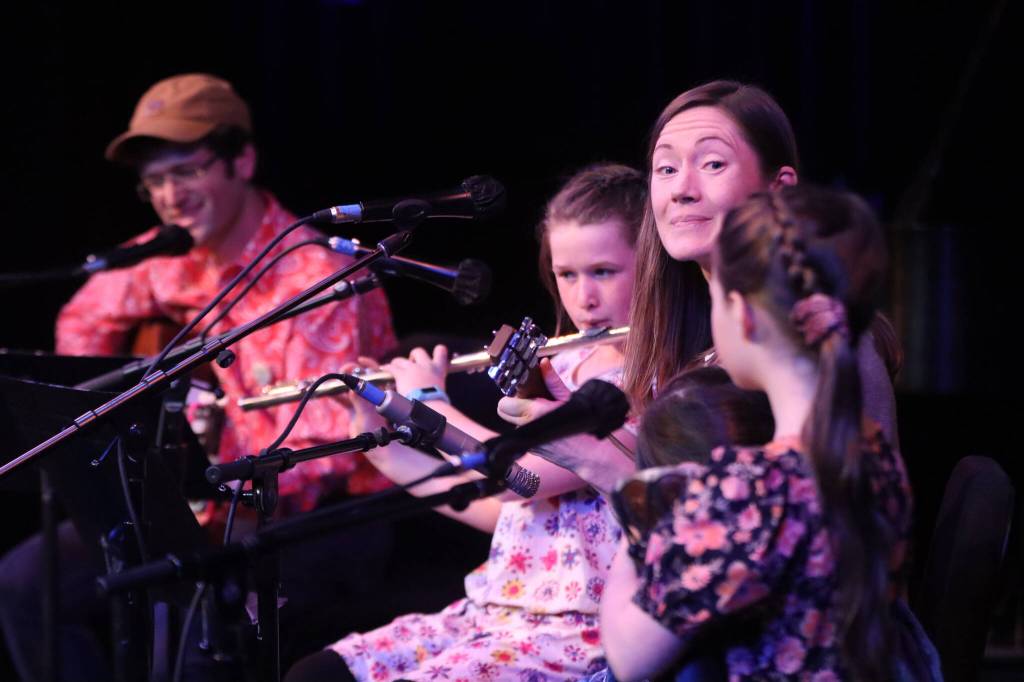 Family band The Whirlybirds, (Kathleen Maynard, Marcelo Maiorano, Cecilia Maiorano, Maelle Maiorano and Lucia Maiorano play the second slot of Saturdays early performances at JDHS for the 48th annual Alaska Folk Fest. (Jonson Kuhn / Juneau Empire)