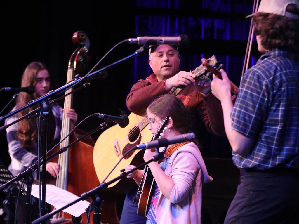 The Koski Family Band, Gracie Koski, Ruby Koski, Warren Koski and Travis Koski plays for the early crowd on Saturday at JDHS during this years annual Alaska Folk Festival. (Jonson Kuhn / Juneau Empire)