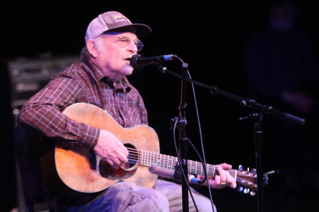 Michael Truax plays his 44th consecutive Alaska Folk Festival on Saturday in the JDHS auditorium to a packed house. (Jonson Kuhn / Juneau Empire)