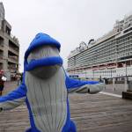 University of Alaska Southeast mascot, Spike, awaits for passengers to pour out of the Norwegian Bliss Monday afternoon. (Clarise Larson / Juneau Empire)