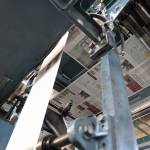 Freshly printed paper makes it way through the Juneau Empire printing press Thursday evening. Beginning May 3, the Juneau Empire will be printed in Washington state, and delivered on Wednesdays and Saturdays. (Clarise Larson / Juneau Empire)