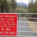 A gate blocks off the entrance to West Douglas Pioneer Road Saturday afternoon. Monday evening the City and Borough of Juneau Assembly voted to reject a proposal from a local company that sought to gain access to provide electric-assisted bicycle tours on the city-owned gravel road. (Clarise Larson / Juneau Empire)