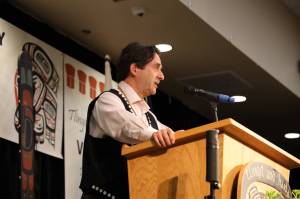 The Central Council of the Tlingit and Haida Indian Tribes of Alaskas representing attorney Philip Baker-Shenk gives a speech Wednesday during the first day of Tlingit and Haidas 88th annual Tribal Assembly. Baker-Shenk addressed the state of Alaskas recent lawsuit against the federal governments approval of the first parcel of land owned by the tribe. (Clarise Larson / Juneau Empire)