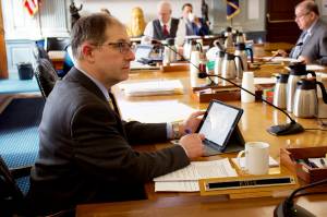 State Sen. Jesse Kiehl, D-Juneau, listens to an overview of the states balance sheet under a proposed budget for next year introduced by the Senate Finance Committee during a hearing Wednesday. The budget contains a surplus of more than $1.4 billion, but thats a misleading number since it doesnt include Permanent Fund Dividends, an increase in education funding and other spending that are virtually certain to be added following public testimony during the next couple of days. (Mark Sabbatini / Juneau Empire)