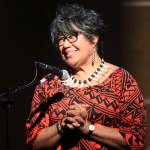 Misuli Smythe tells a personal story about her sister Tuesday night at Ḵunéix̱ Hídi Northern Light United Church as part of Mudrooms season finale. (Jonson Kuhn / Juneau Empire)