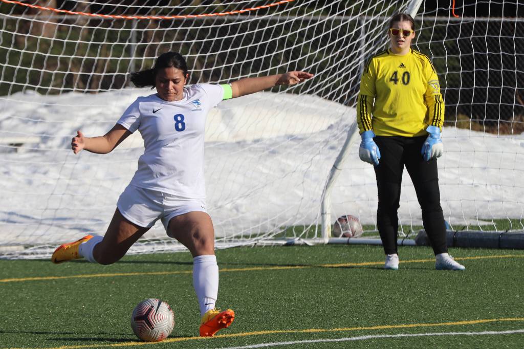 TMHS senior Mercedes Cordero (8) kicks the ball down field for the Falcons on Tuesday during a conference game against JDHS. (Jonson Kuhn / Juneau Empire)