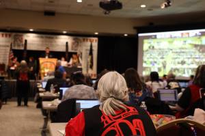 A delegate watches the proceedings during the final day of the 88th annual Tribal Assembly of the Central Council of the Tlingit and Haida Indian Tribes of Alaska on Friday at Elizabeth Peratrovich Hall. (Clarise Larson / Juneau Empire)