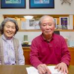 Emiko and Syun-Ichi Akasofu serve tea to guests at their home in Fairbanks in December 2021. (Courtesy Photo / Ned Rozell)