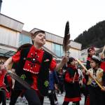 Students from the Tlingit Culture, Language and Literacy program at Harborview Elementary dance during the procession of the dedication ceremony of the Kootéeyaa Deiyí, Totem Pole Trail, held Saturday in downtown Juneau at Heritage Plaza.	(Clarise Larson / Juneau Empire)