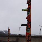 A totem pole by Tsimshian carver Gyibaawm Laxha David Robert Boxley stands tall during a light drizzle Saturday afternoon after the dedication ceremony. (Clarise Larson / Juneau Empire)