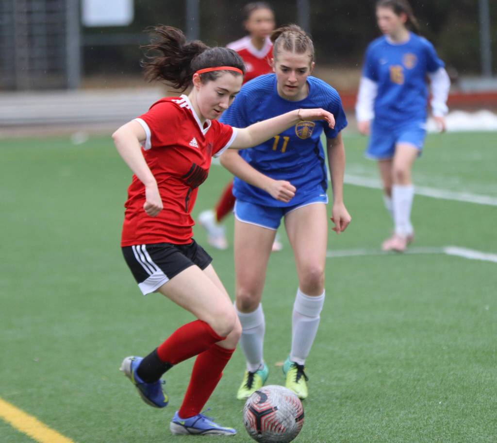 JDHS sophomore Cerys Hudson (6) makes a steal against Wheat Ridge senior Acacia Seeling (11) on Saturday at Adair Kennedy field for a non-conference game during the Colorado teams two game visit to Juneau. (Jonson Kuhn / Juneau Empire)