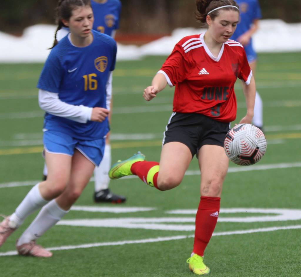 JDHS junior Ruby Rivas passes the ball away from Wheat Ridge junior Nina Hubbard (16) on Saturday for a non-conference game at Adair Kennedy field. (Jonson Kuhn / Juneau Empire)