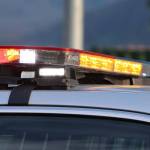 Emergency lights flash on top of a police car. (Ben Hohenstatt / Juneau Empire File)