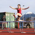 Juneau-Douglas High School: Yadaa.at Kalé sophomore Serena Crupi jumps over a hurdle at the Capital Invitation Track and Field Meet at Thunder Mountain High School Friday evening. (Clarise Larson / Juneau Empire)