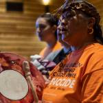 A welcome song is played and sang by Tulalip performers during a Road to Healing event at the Tulalip Gathering Hall in Marysville, Washington on Sunday, April 23, 2023. The tour is lead by United States Secretary of the Interior Deb Haaland and Department of the Interior Assistant Secretary Bryan Newland. (Annie Barker / The Herald)